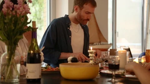 Handheld shot of three people having dinner on the dinner table Stock-Footage 114846681