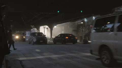 Handheld shot of traffic at the intersection of Broadway and Myrtle Stock Footage 262608176