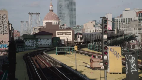 Handheld shot of a train arriving at a subway station in Williamsburg, Brooklyn Stock Footage 327803053