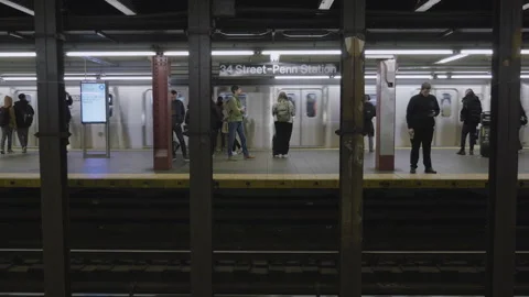 Handheld shot of a train leaving Penn Station Stock Footage 273446175