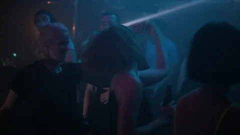 Handheld shot of two beautiful young ladies dancing on dance floor Video stock 114848349