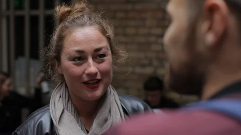 Handheld shot of two friends talking at an event Stock-Footage 114847089