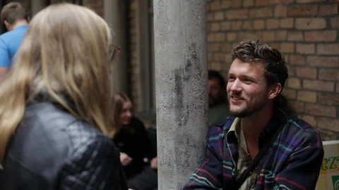 Handheld shot of two friends talking at the event Stock Footage 114847188