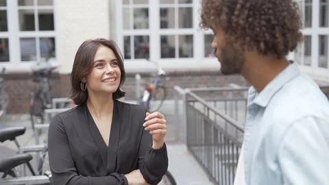Handheld shot two young friends talking with each other Vídeo Stock 114877265