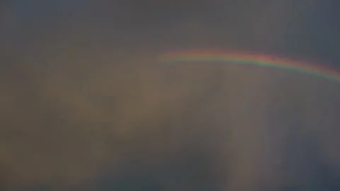 Handheld Shot of Vibrant Rainbow at Sunset in the USA with Moody Clouds Stock Footage 342301938
