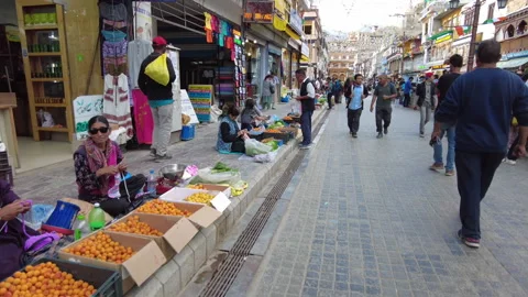 Handheld shot, walking on Main Bazaar street of Leh Ladakh in late afternoon. Stock Footage 257097517