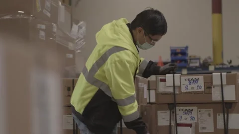 Handheld Shot Of Warehouse Worker Working During Covid 19 2 Stock Footage 168162709