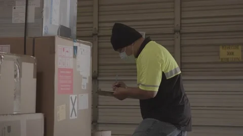 Handheld Shot Of Warehouse Worker Working During Covid 19 3 Stock Footage 168162955