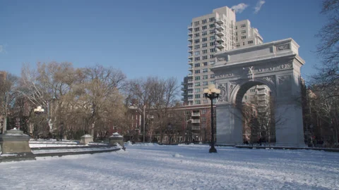 Handheld shot of Washington Square Park on a winter morning Stock Footage 329474228