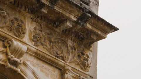 Handheld shot of water dripping down from roof and balcony, rainy season, Cuba Stock Footage 142212749