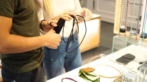 Handheld shot of young couple browsing for items in shop Stock-Footage 114884110