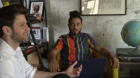 Handheld shot of young creative professionals discussing new project at office Stock Footage 114855601