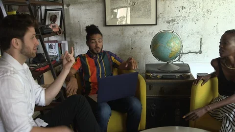 Handheld shot of young executives having meeting over new business project Stock Footage 114855522