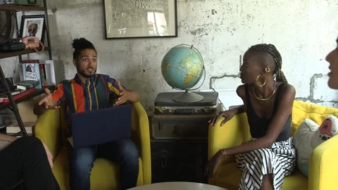 Handheld shot of young executives having meeting over new business project Video stock 114855531