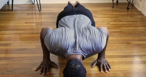 Handheld shot of young man doing Push-up Stock Footage 120421514