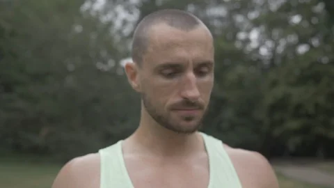 Handheld shot of young man drinking water after workout Stock-Footage 114843626