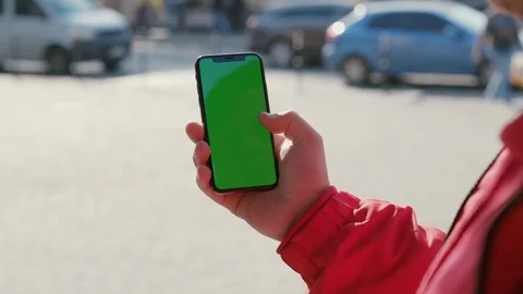 Handheld shot of young man using vertical smartphone with modern application on Stock Footage 117428534