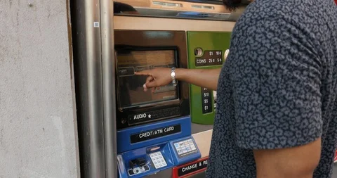 Handheld shot of young man using ATM machine Stock Footage 120147323
