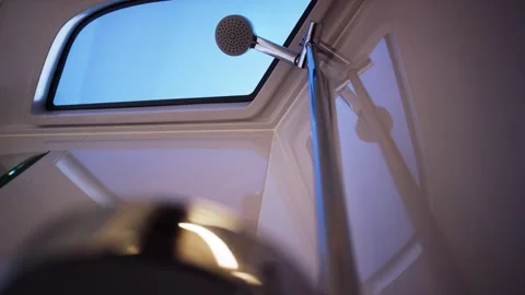 Handheld Shower Head on Chrome Rail by Bathroom Window, Blue Hour, Slow Pan Video stock 340337979