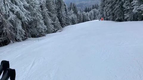 Handheld, ski slope, going down the mountain, grey day, 60fps, French Alps Stock Footage 104169290