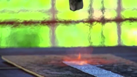 Handheld slow motion close up of metal cutting with sparks and flame 動画素材 332923228