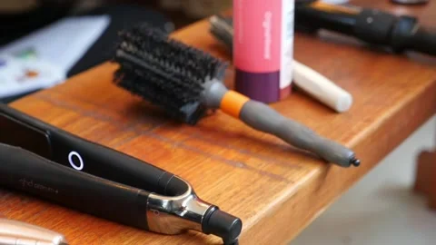 Handheld, slow motion, movement of professional hair stylist equipment Stock Footage 155473367