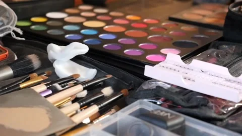 Handheld, slow motion, movement of professional makeup artist bench Stock Footage 155473373