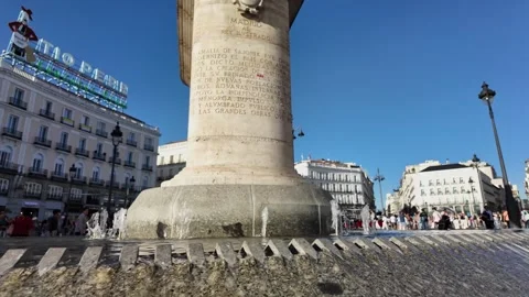 Handheld Slow Motion of Puerta del Sol Fountain in Madrid on a Sunny Day Stock Footage 345843297
