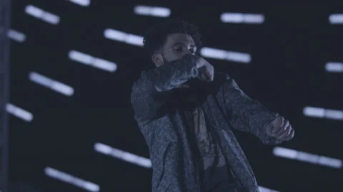 Handheld slow motion shot of grooving black male dancer in dark room Stock Footage 211869958