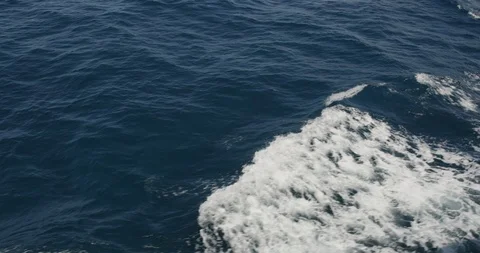 Handheld slow motion shot of wavy dark blue sea, Japan Stock Footage 124720277