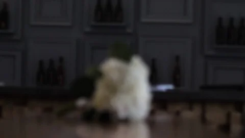 Handheld slow motion shot of wedding flowers bouquet on table	 Video stock 122607781