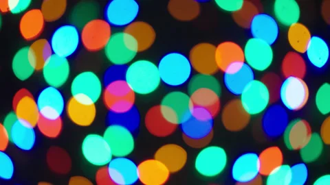 Handheld Slow Pan Up Christmas Tree Lights Bokeh Blurred Colorful Видео 334238749