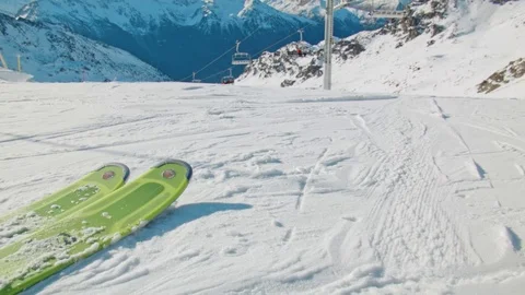 Handheld slowmotion people starting to ski of the white snowy mountains Stock Footage 71124101