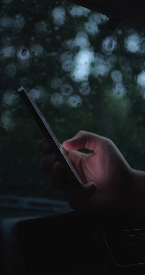 Handheld Smartphone In Hand Inside Car During Rain... Stock Footage 332075609