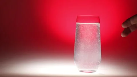 Handheld Sparkling Water with Rising Bubbles Stock Footage 256764459