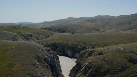 Handheld Static Shot of Green Mountain Valley with Rocky Canyon Stock Footage 315829429