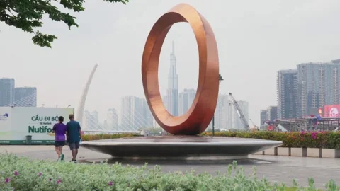 Handheld Static Shot Of Modern Circular Ring Monument At Saigon River Park Stock Footage 343881875