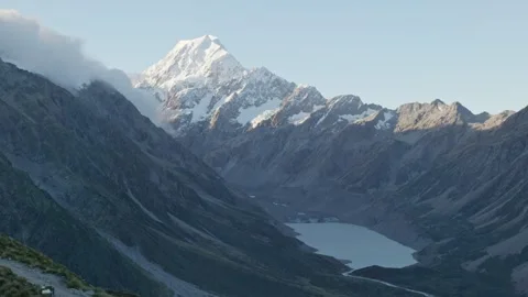Handheld static shot of Mount Cook rising above Hooker Lake, captured from the Stock Footage 313341896