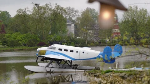 Handheld Static Shot Overcast Vintage Seaplane Moored on Lake, Pairi Daiza Zoo Stock Footage 341460374