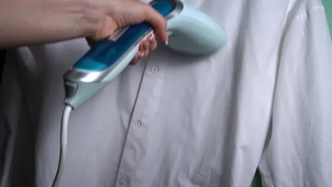 Handheld Steam Iron Smoothing White Shirt Video stock 265863751
