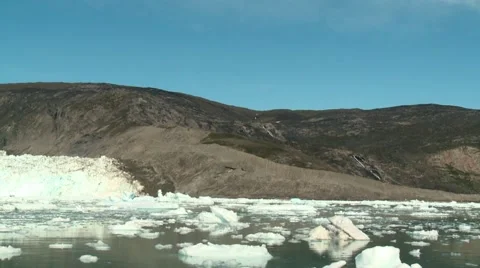 Handheld still of floating ice in front of a calving glacier in Greenland Video stock 60004619