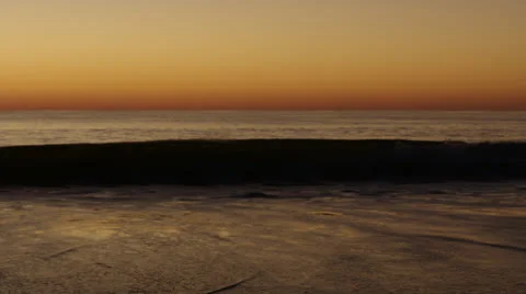 Handheld surf breaks at early dusk b, 60fps -ext Stock Footage 24673136