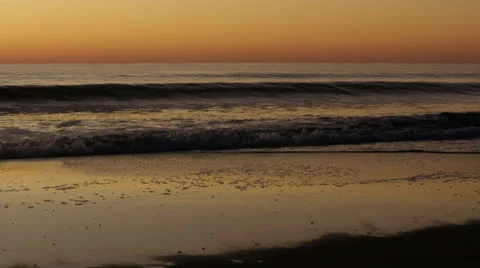 Handheld surf breaks at early dusk c, 60fps Video stock 24673400