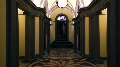 Handheld tilt up shot of corridor interior and ceiling of old building Stock Footage 120427716