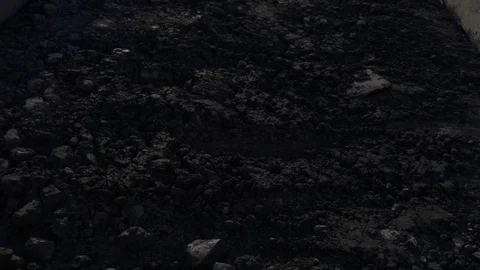 Handheld tilt-up shot of freight train with empty gondola cars moving around the Stock Footage 75263369