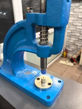 Handheld tool creates precise shapes and patterns in a workshop setting Stock Photos