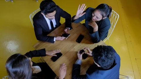Handheld top angle shot of friends during a break from coworking space and celeb Stock Footage 104530640