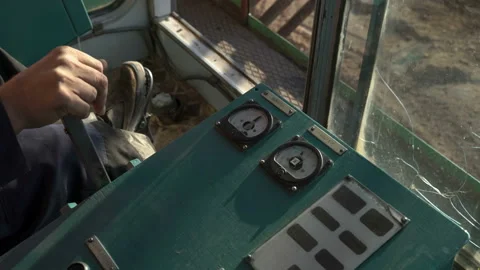 Handheld tracking shot of operating walking excavator by driver. Inside the cab. Video stock 87729545