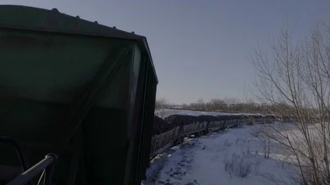 Handheld tracking shot of unloading platform with copper ore at sunset Stock Footage 75260530