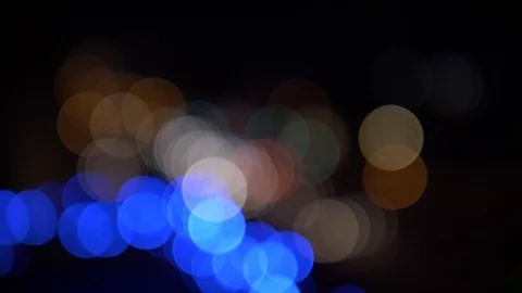 Handheld: Traffic lights at blurry night Stock Footage 100130772